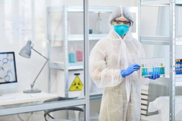 istock Unrecognizable Woman Holding Test-Tubes 1210082025