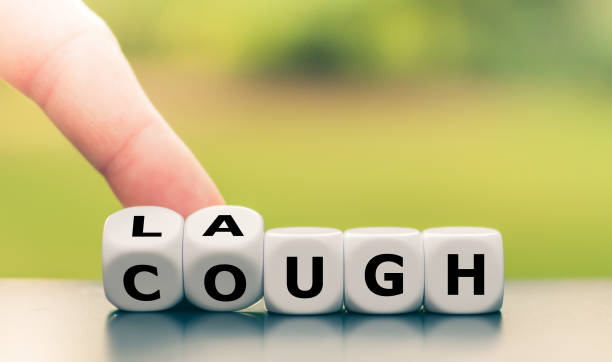 istock Laughter is the best medicine. Hand turns dice and changes the word 