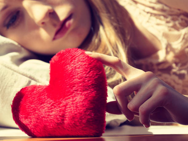 istock Sad woman on Valentines day 1210089586