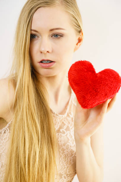 istock Sad woman on Valentines day 1210089594