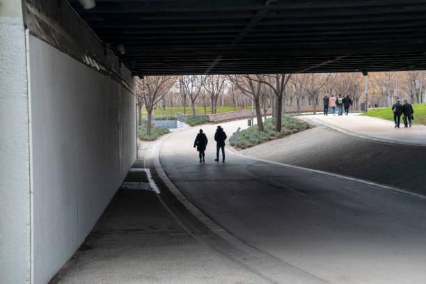 istock People walking under a bridge. Madrid Rio 1210089879