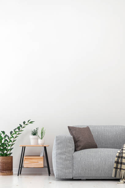 istock Empty living room with gray sofa, table and decoration 1210090847