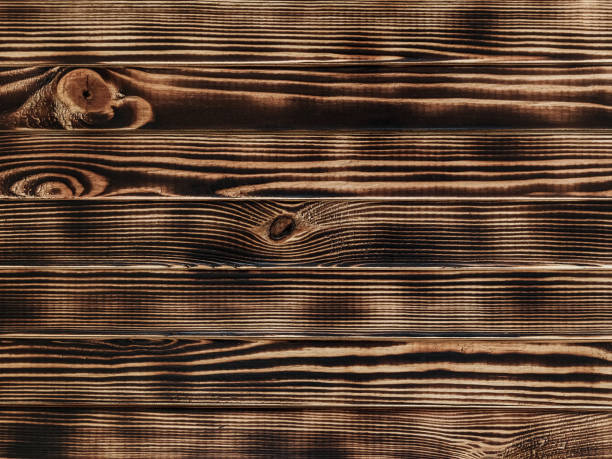 istock burnt pine - wooden table with narrow boards - background 1210102730