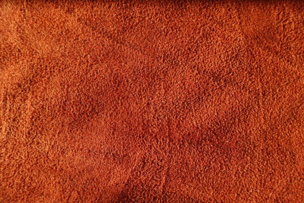 istock Close view of reddish orange artificial suede fabric 1210103035