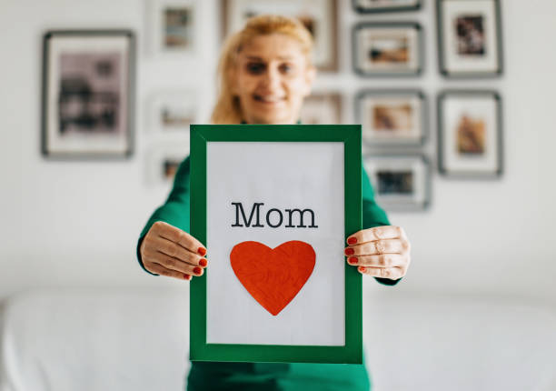 istock One woman holding a sign 1210104515