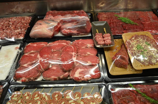 istock fresh meat in butcher refrigerator stock photo 1210104594