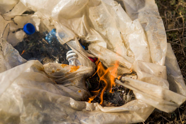 istock Flames and smoke burn plastic waste to pollute the air 1210108881