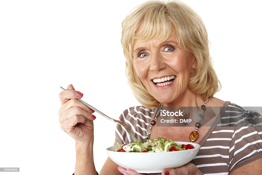 Idosa a comer uma salada-isolada - Royalty-free 60-69 Anos Foto de stock