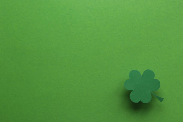 istock Still life clover paper sheet on green background 1210111752