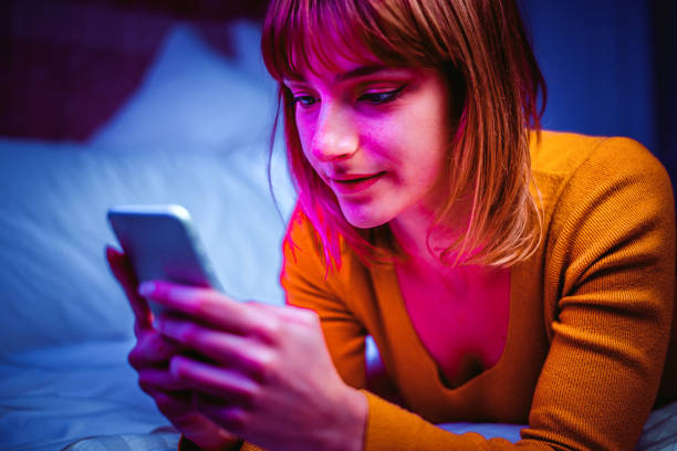 istock Young adult using smartphone at home 1210112376