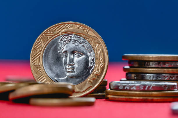 istock Brazilian coin. Coins from Brazil on a table. 1210113351