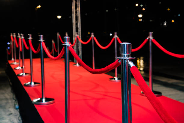 istock Red carpet with barriers 1210115035