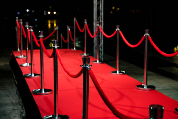 istock Red carpet with barriers 1210115250