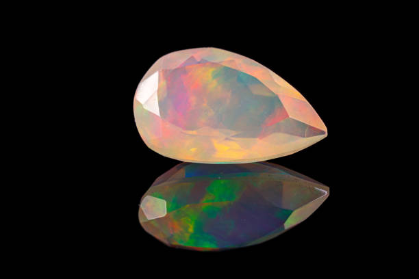istock macro mineral stone faceted opal on a black background 1210115272