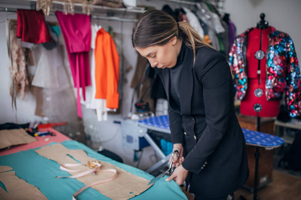 istock Female fashion designer working in her workshop 1210115293