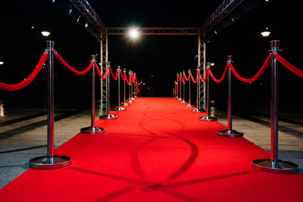 istock Red carpet with barriers 1210115324