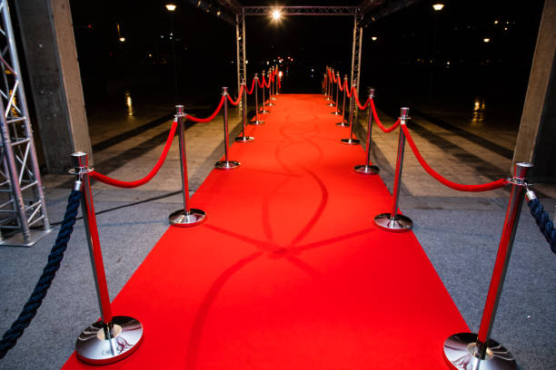 istock Red carpet with barriers 1210115408