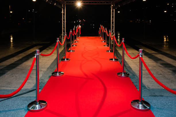 istock Red carpet with barriers 1210115417