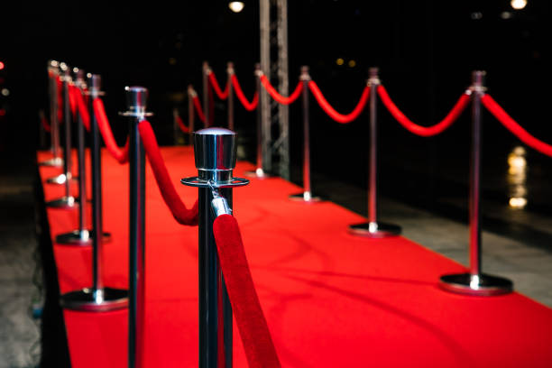 istock Red carpet with barriers 1210115418
