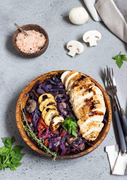 istock Roasted chicken breast and stewed red cabbage with mushrooms and tomatoes. 1210115856