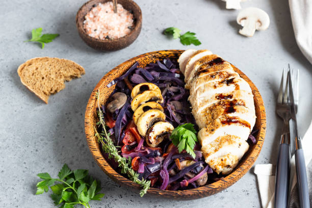 istock Roasted chicken breast and stewed red cabbage with mushrooms and tomatoes. 1210115959
