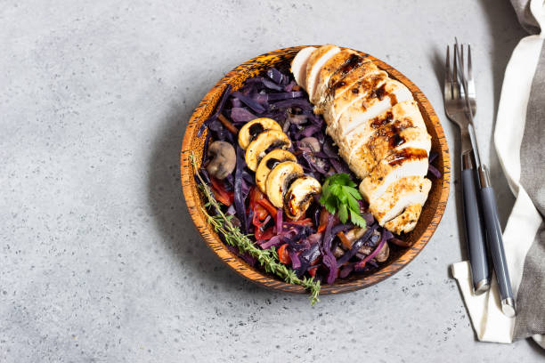 istock Roasted chicken breast and stewed red cabbage with mushrooms and tomatoes. 1210115971