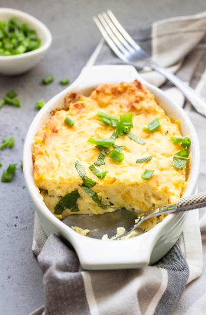 istock Potato casserole with fish and cheese on a light grey background. 1210116657