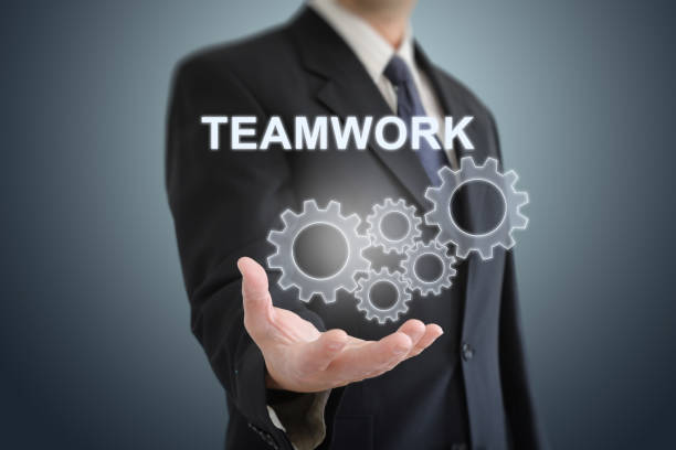 Teamwork cogwheel cooperation businessman togetherness partnership