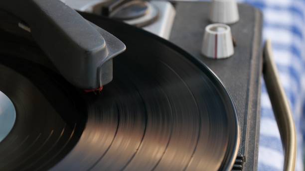istock Vinyl record spinning. Needle playing record album on a vintage turntable. 1210118158