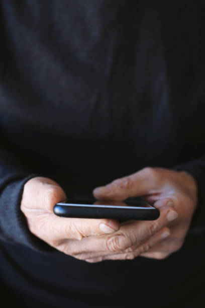 istock Man holding mobile phone 1210118402