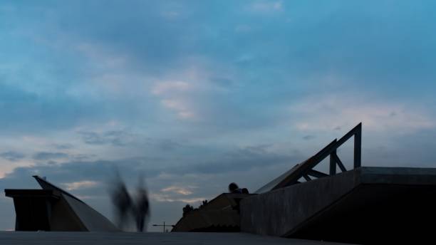 unidentified silhouetted people crossing bridge at Karsiyaka izmir unidentified silhouetted people crossing Bridge at Karsiyaka izmir Turkey. 4K long exposure winter crowd blurred motion stock pictures, royalty-free photos & images