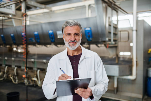 istock Man manager working on diary farm, agriculture industry. 1210119966