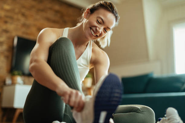 Happy athletic woman preparing for the workout.
