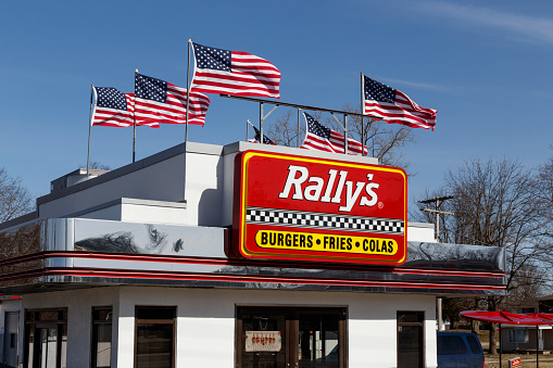 Muncie - Circa February 2020: Rally's Drive Thru fast food restaurant. Rally's is the sister of Checkers