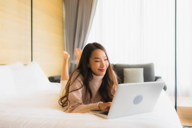 istock Portrait beautiful young asian woman using laptop for working 1210123409