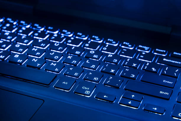 istock laptop keyboard dark blue illumination trendy color year 2020 computer technology object background view with bottoms 1210125198