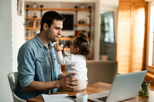 istock Working father spending time with his small daughter at home. 1210127155
