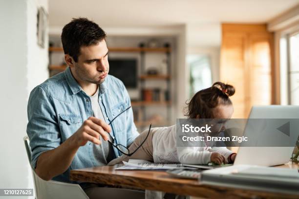 Babysitting And Working At Home Stock Photo - Download Image Now - Working At Home, Domestic Life, Working