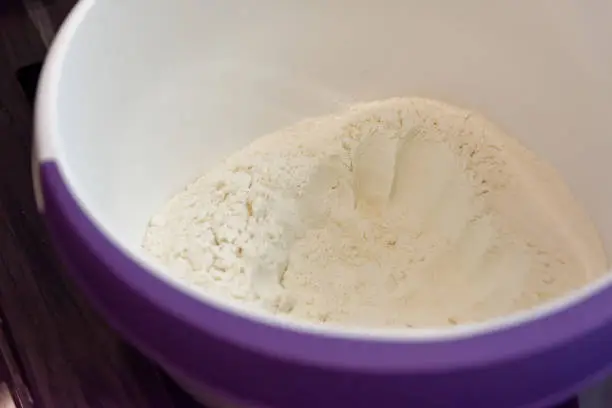 a bowl of flour in closeup view