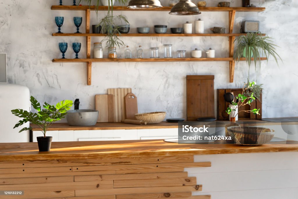 Spacious loft industrial open space kitchen studio interior with kitchen appliances and sink Apartment Stock Photo