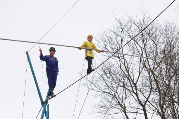 Saint - Petersburg.Russia.March 1.2020.Uzbek tightrope walkers perform at the festival of farewell to winter.This is a spectacular and dangerous attraction.