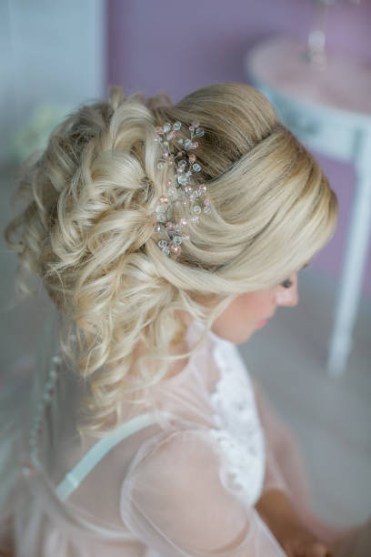 istock Wedding hairstyle on a woman's head. close up rear view 1210132689