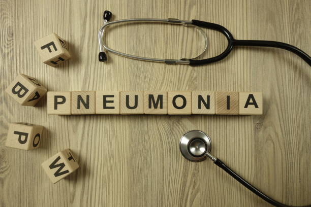 istock Word pneumonia from wooden blocks with stethoscope 1210134298