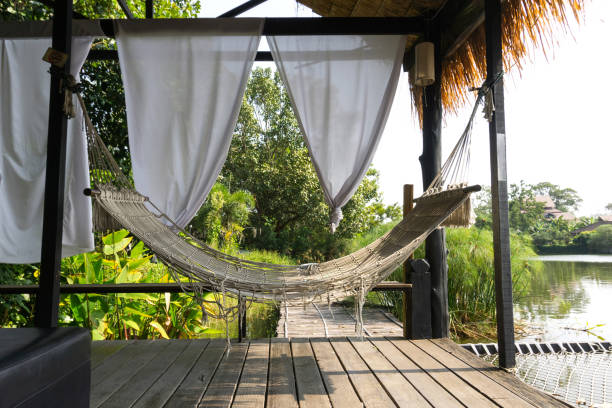 istock Hammock hanging in wooden hut for relaxing 1210137889