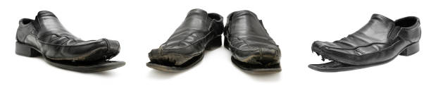 Set old shabby, torn-soled shoes