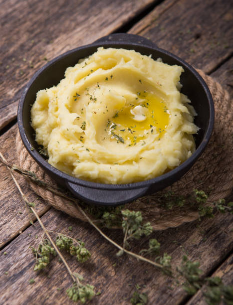 istock Fresh homemade creamy mashed potato or  potato puree in pan 1210138242