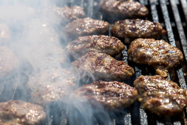 istock Meatballs on Barbecue with smoke 1210138781