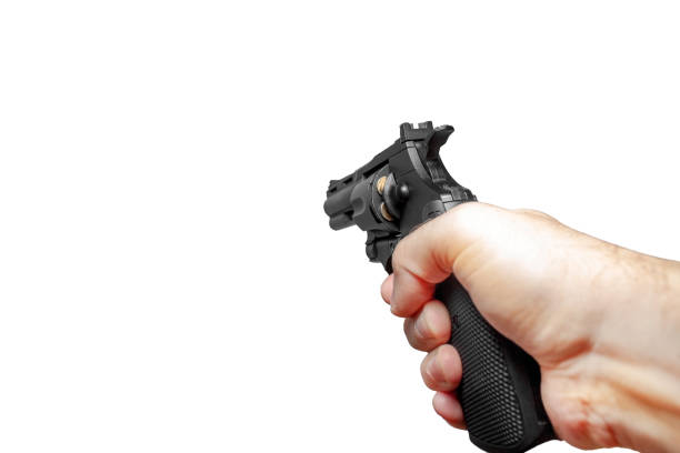 istock A man 's hand with a black charged revolver is aiming ahead 1210139065