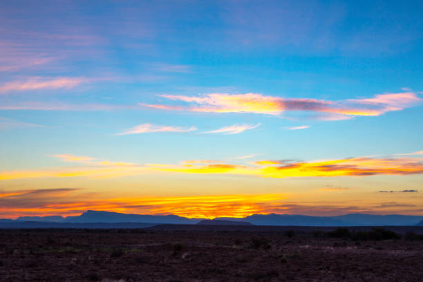 istock Yellow clouds and blue mountains at sunset in the Karoo 1210139111