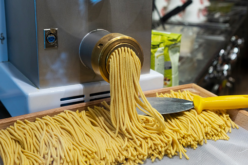 Pasta maker in a restaurant, Italy